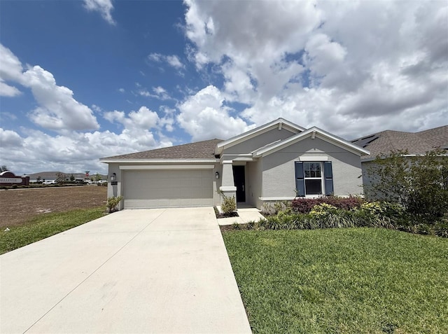 945 Laurel View Way, Groveland, FL 34736 - single story home featuring stucco siding, an attached garage, concrete driveway, and a front yard