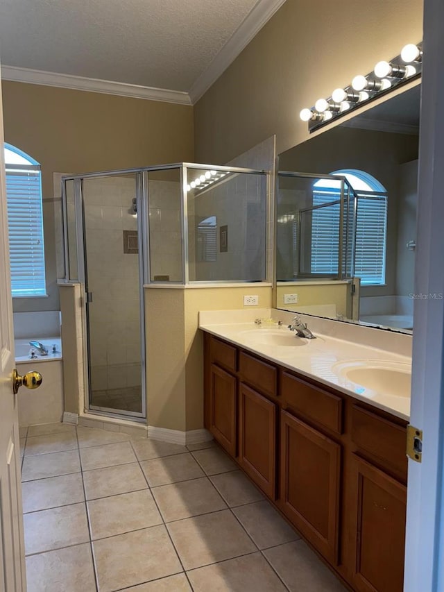 full bath featuring a sink, crown molding, and tile patterned flooring