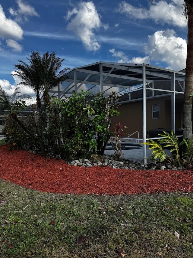 view of yard featuring a lanai