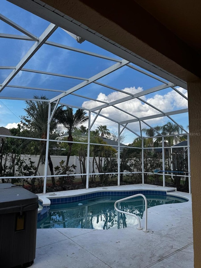 view of pool with a fenced in pool, a hot tub, a lanai, and a patio area