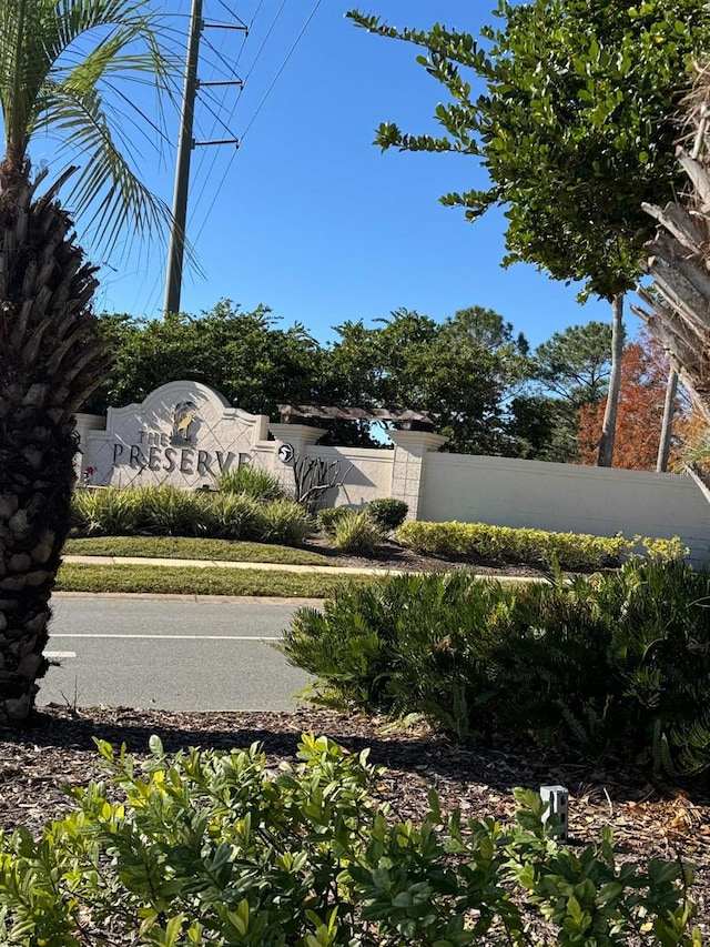 community sign with fence