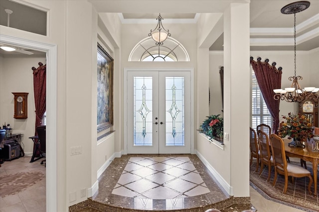 entryway featuring an inviting chandelier, french doors, and a wealth of natural light