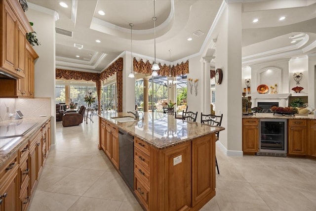 kitchen with beverage cooler, dishwasher, a raised ceiling, and a sink