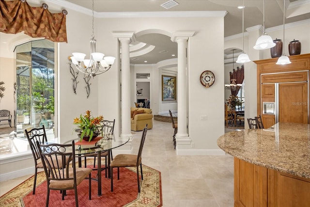 dining area featuring visible vents, ornate columns, arched walkways, crown molding, and a chandelier