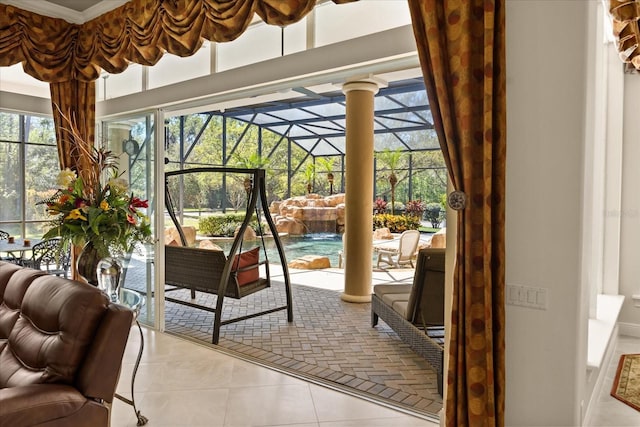 sunroom / solarium featuring ornate columns