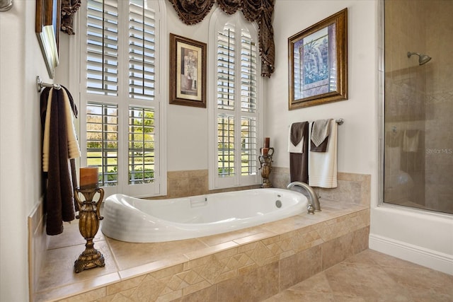 full bathroom featuring tile patterned floors, tiled tub, and a tile shower