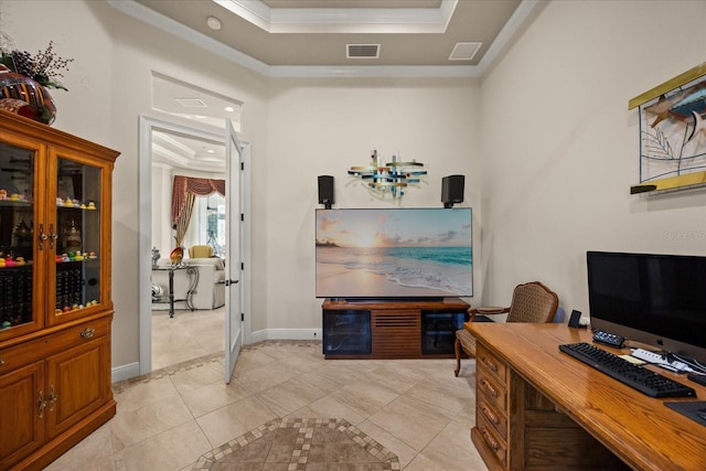 office area featuring visible vents, baseboards, ornamental molding, light tile patterned floors, and a raised ceiling