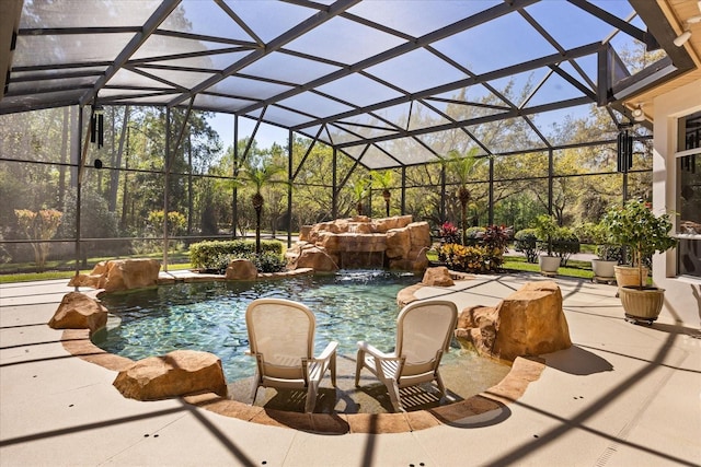 outdoor pool with glass enclosure and a patio