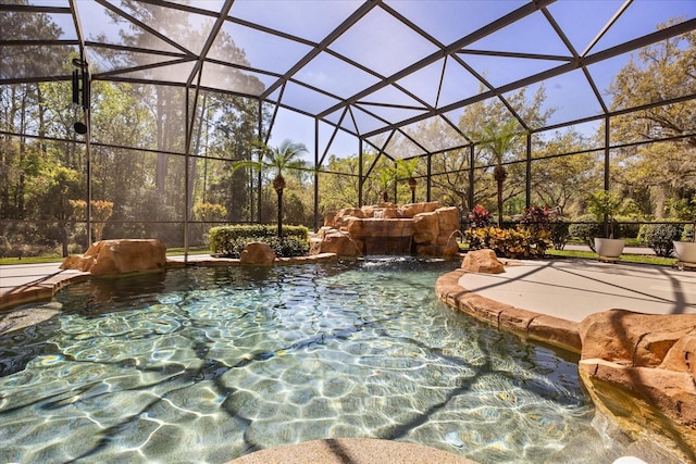 view of patio featuring an outdoor pool and glass enclosure