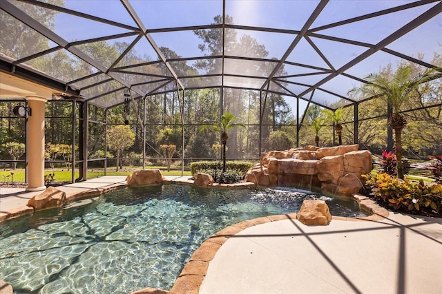 view of patio / terrace featuring a lanai and an outdoor pool