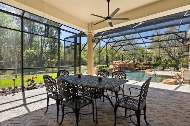 sunroom featuring ceiling fan