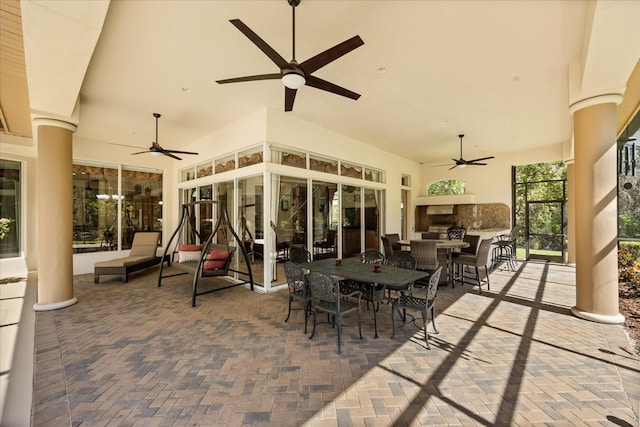 view of patio / terrace with outdoor dining area and a ceiling fan