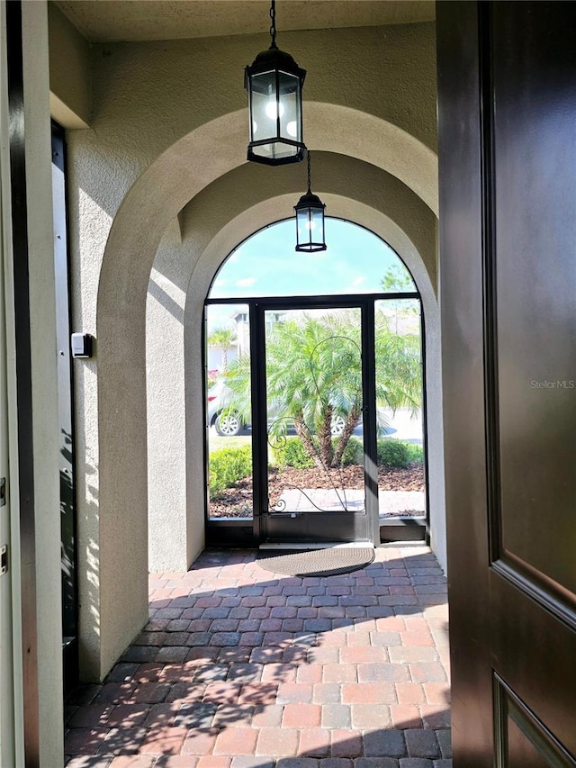 entrance to property with stucco siding