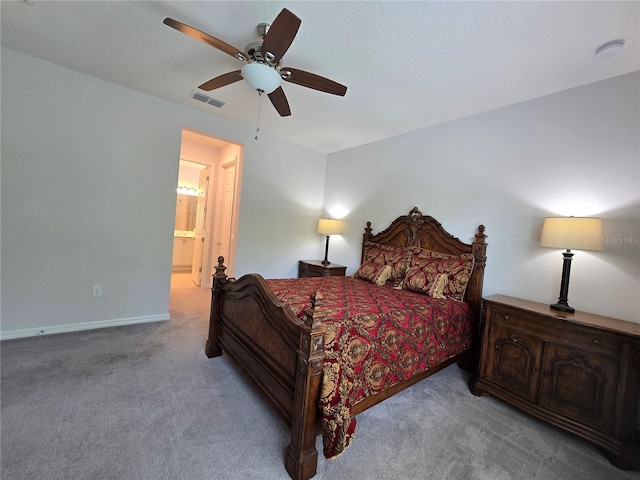 bedroom featuring visible vents, connected bathroom, carpet flooring, baseboards, and ceiling fan