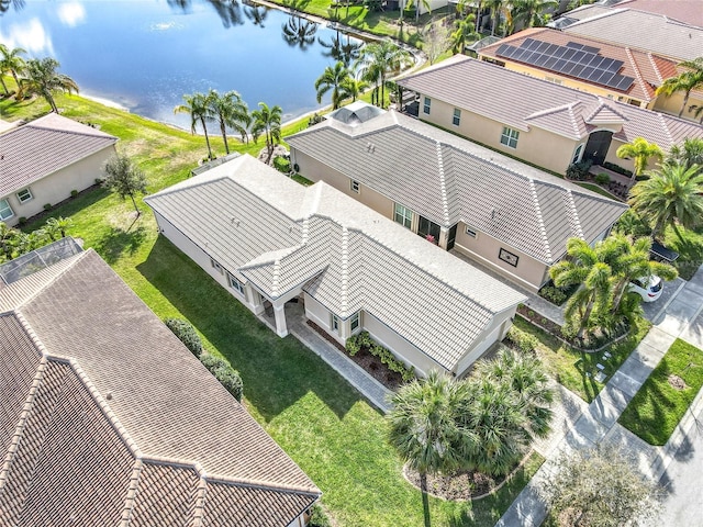 bird's eye view featuring a water view and a residential view