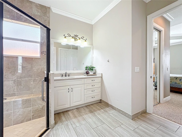 bathroom with a shower stall, vanity, ensuite bathroom, and ornamental molding