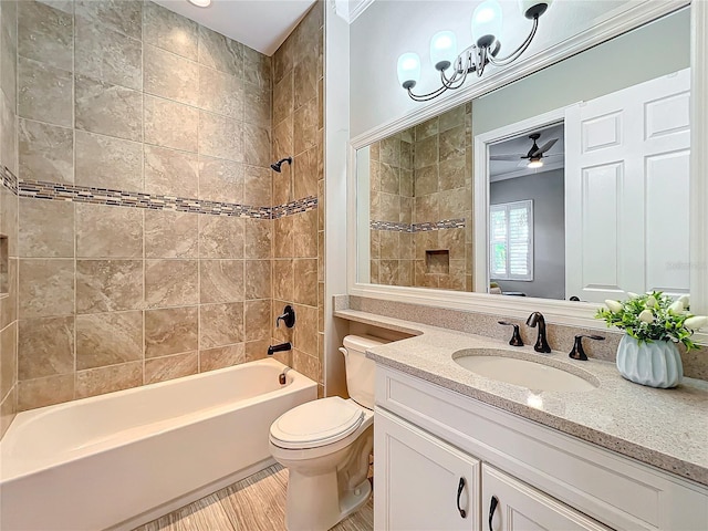 bathroom with a ceiling fan, toilet, vanity, and shower / tub combination