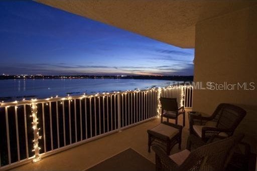 balcony featuring a water view