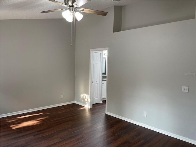 unfurnished room featuring baseboards, a textured ceiling, ceiling fan, and dark wood-style flooring