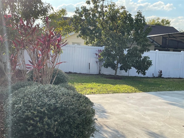 view of yard featuring a patio area and fence