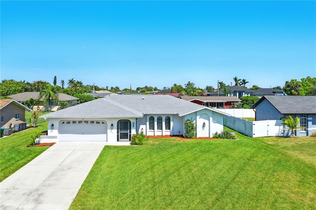 single story home with a front lawn, fence, concrete driveway, an attached garage, and a gate