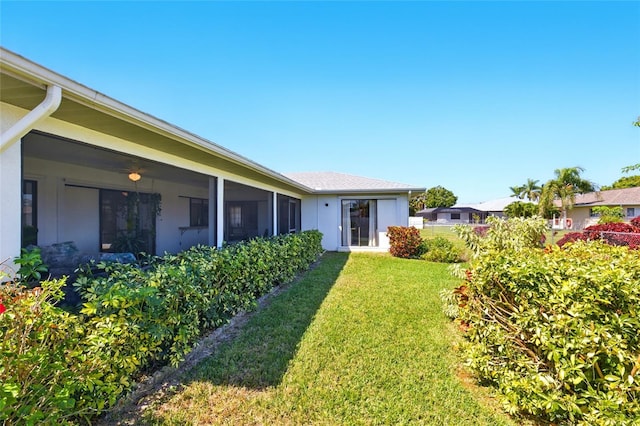 view of yard with a sunroom