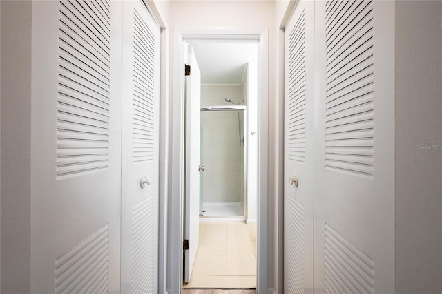 hall with tile patterned flooring