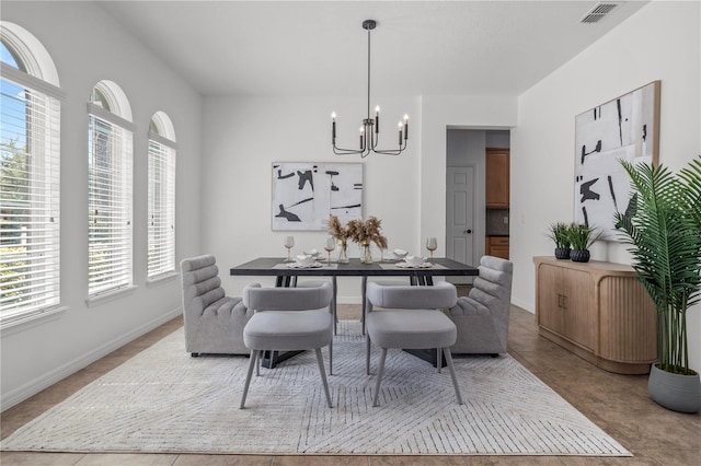 dining room with an inviting chandelier, light tile patterned floors, baseboards, and visible vents