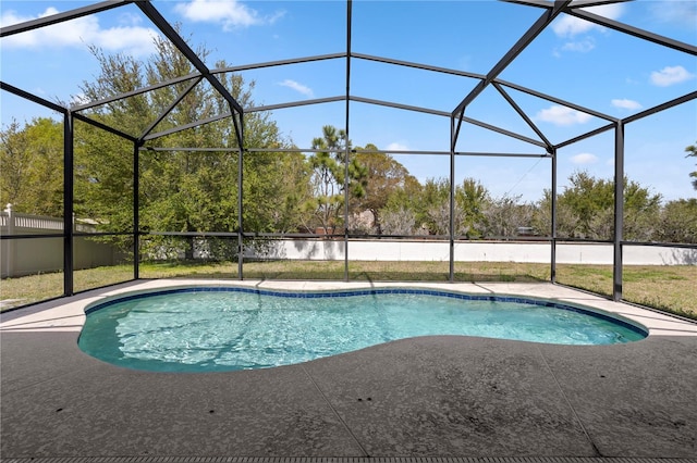 outdoor pool with a lanai and a patio