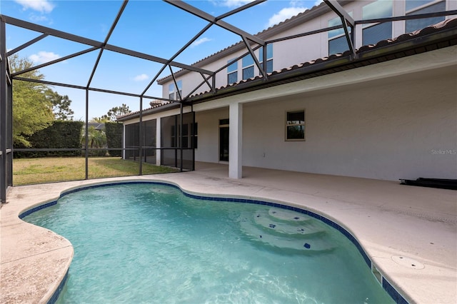 pool with a lanai and a patio area