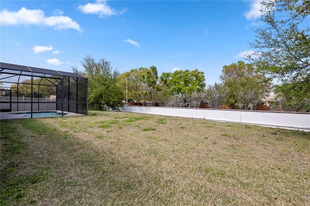 view of yard featuring an outdoor pool and a lanai