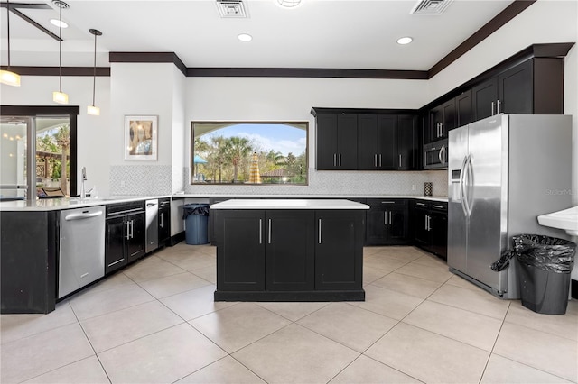 kitchen featuring stainless steel appliances, visible vents, dark cabinets, and light countertops