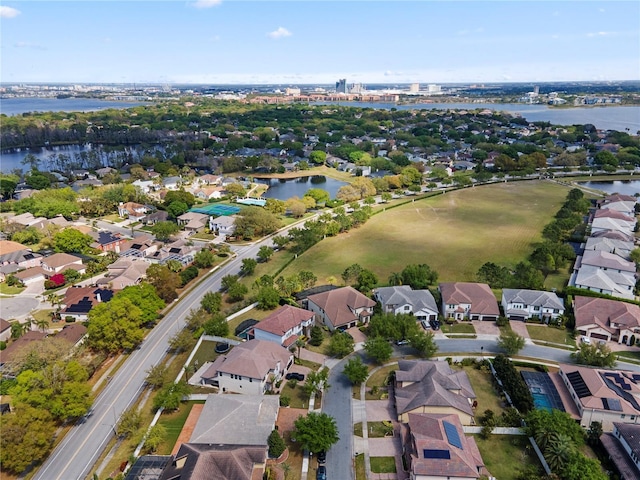 drone / aerial view featuring a water view and a residential view