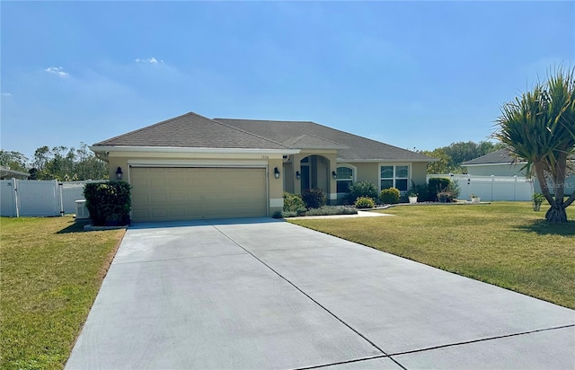 ranch-style house featuring stucco siding, a gate, concrete driveway, a front yard, and a garage