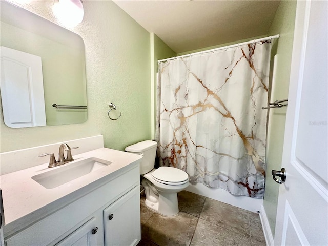 bathroom featuring toilet, vanity, shower / bath combo, and a textured wall