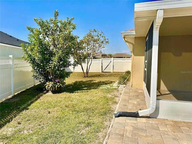 view of yard with a patio and a fenced backyard