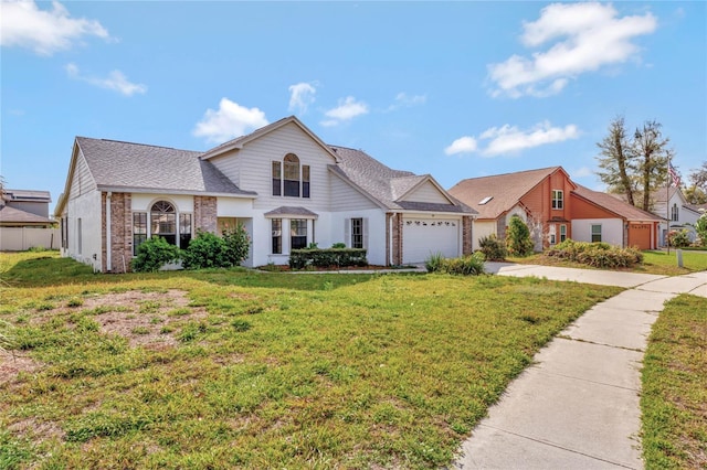 view of front of property featuring a garage, driveway, brick siding, and a front yard