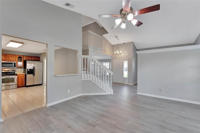 unfurnished living room with visible vents, light wood-style flooring, ceiling fan with notable chandelier, stairway, and baseboards