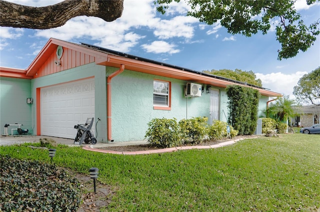 view of property exterior featuring a yard, board and batten siding, an attached garage, and a wall unit AC