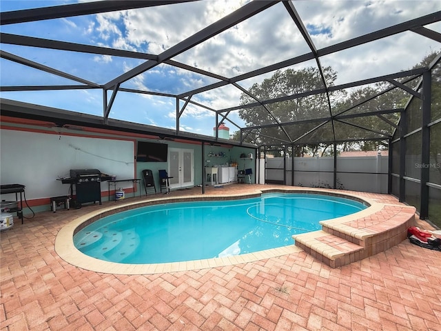 view of swimming pool with grilling area, a fenced in pool, fence, french doors, and a patio