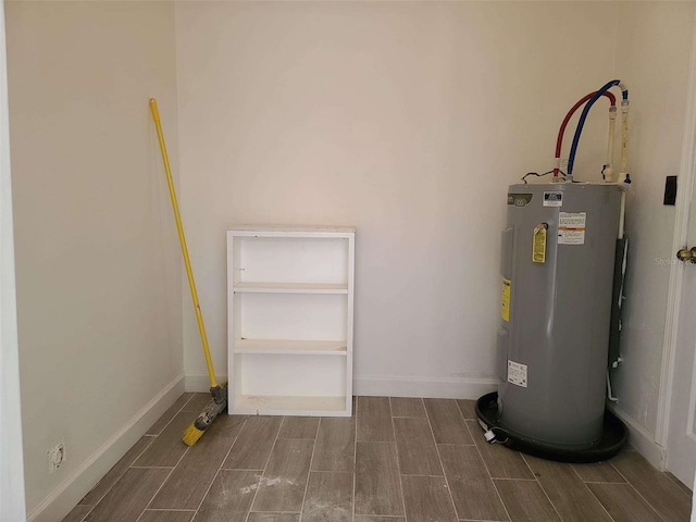 utility room featuring water heater
