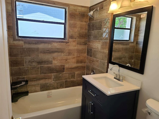 bathroom featuring shower / washtub combination, vanity, and toilet