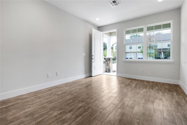 4409 Summer Flowers Pl, Kissimmee, FL 34746 - empty room featuring recessed lighting, wood finished floors, visible vents, and baseboards