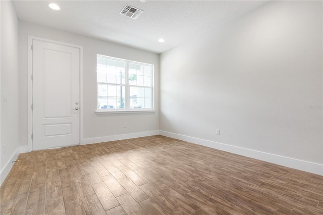 4409 Summer Flowers Pl, Kissimmee, FL 34746 - empty room featuring recessed lighting, visible vents, baseboards, and wood finished floors