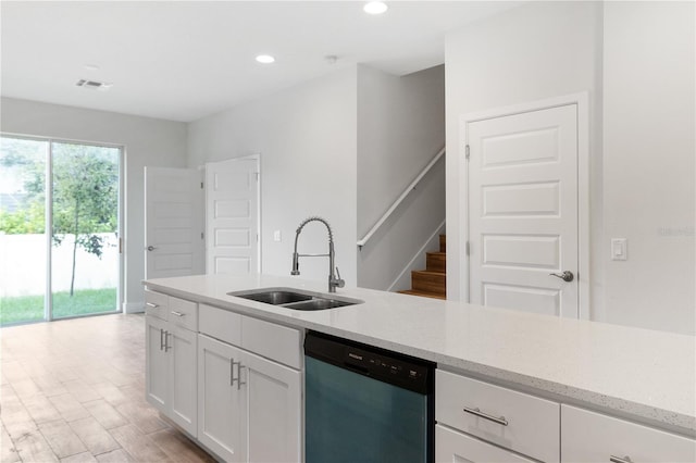 4409 Summer Flowers Pl, Kissimmee, FL 34746 - kitchen with light stone countertops, white cabinetry, recessed lighting, a sink, and dishwasher