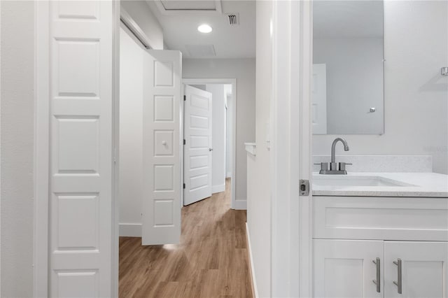 4409 Summer Flowers Pl, Kissimmee, FL 34746 - bathroom featuring visible vents, vanity, baseboards, and wood finished floors
