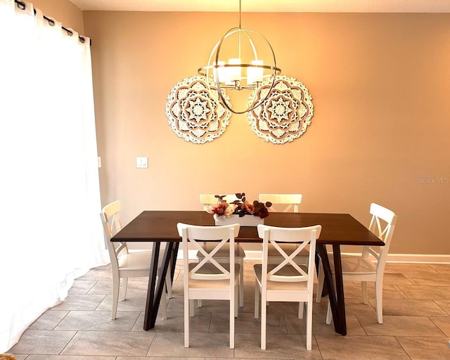dining room with a notable chandelier