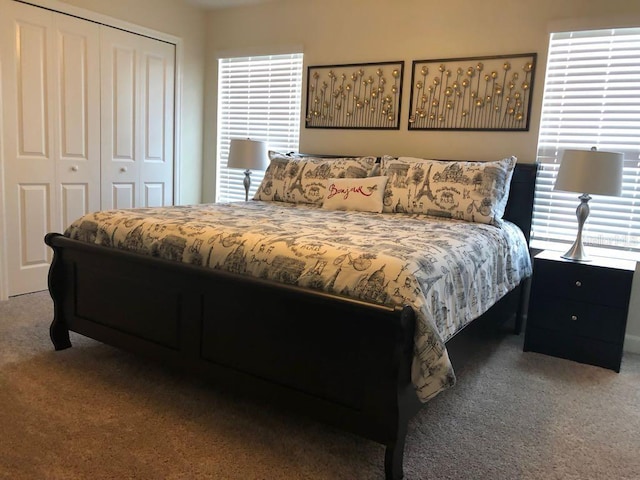 carpeted bedroom with a closet