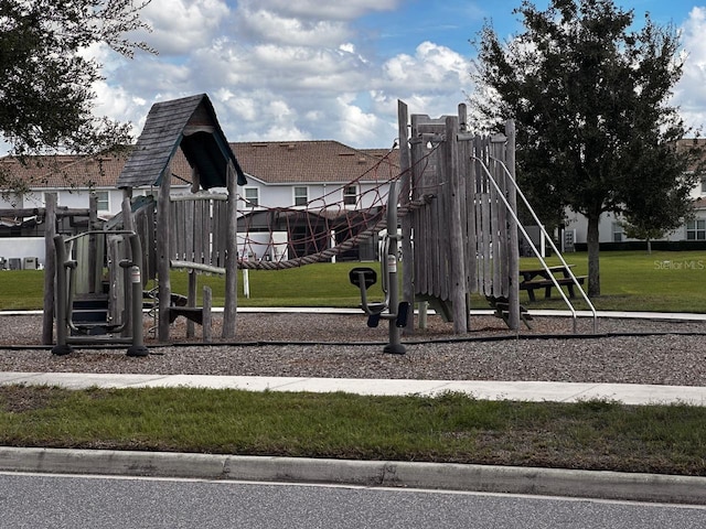 community jungle gym with a yard