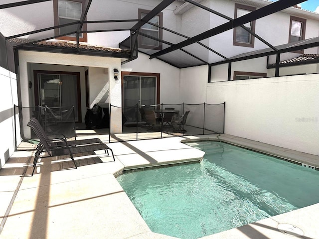 view of pool featuring a patio area, a fenced in pool, and a lanai